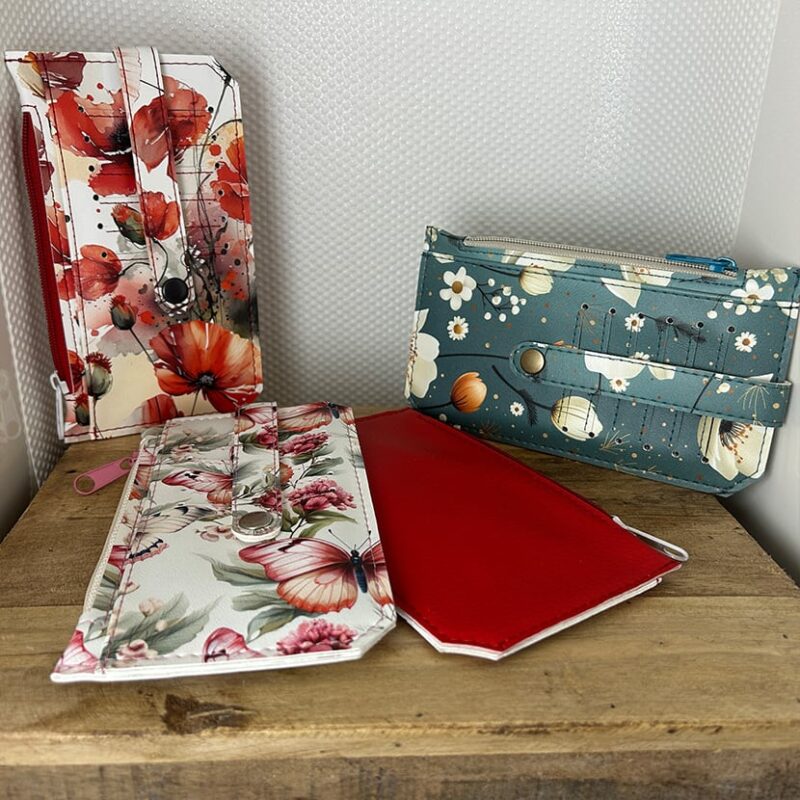 Drei handgemachte Geldbörsen – mit Mohnblumen, Schmetterlingsmotiv oder türkisfarbenem Blütendesign